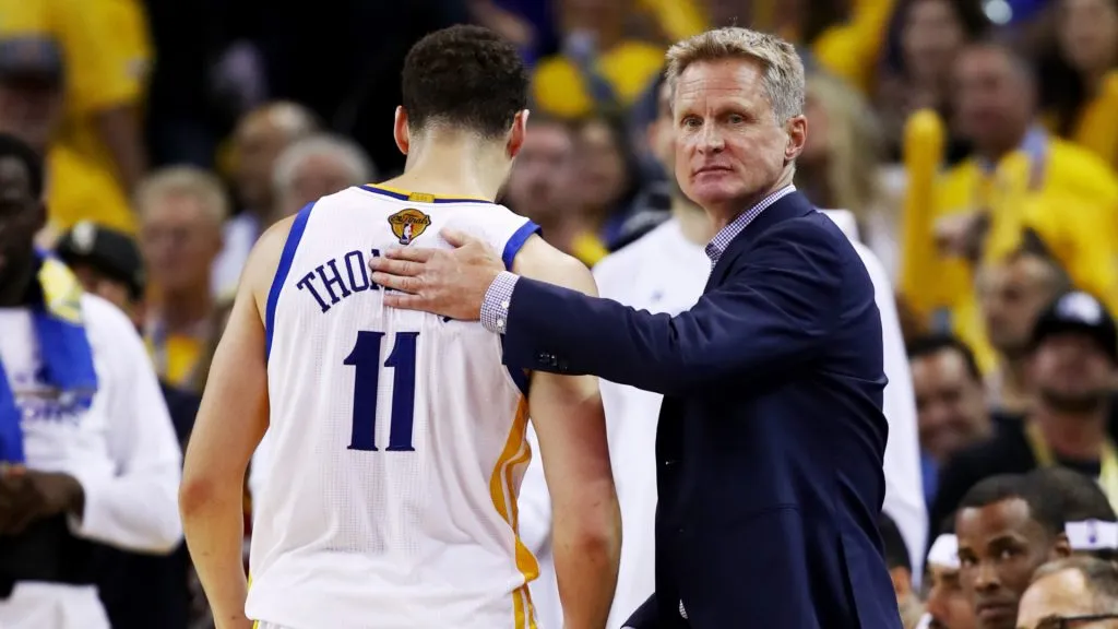 Steve Kerr congratulates Klay Thompson #11 of the Golden State Warriors as he comes off the court against the Cleveland Cavaliers. Ezra Shaw/Getty Images