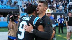 Dave Canales and Bryce Young of the Carolina Panthers embrace after a win.