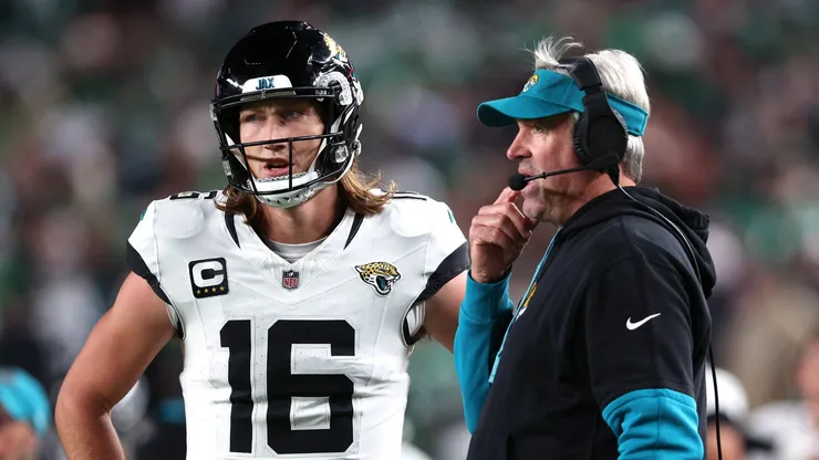 Trevor Lawrence #16 and head coach Doug Pederson of the Jacksonville Jaguars talk in the third quarter of a game against the Philadelphia Eagles at Lincoln Financial Field on November 03, 2024 in Philadelphia, Pennsylvania.
