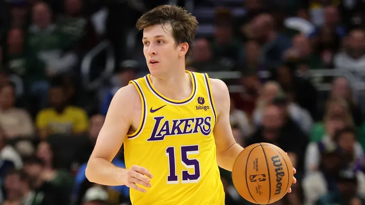 Austin Reaves #15 of the Los Angeles Lakers handles the ball during a game against the Milwaukee Bucks.
