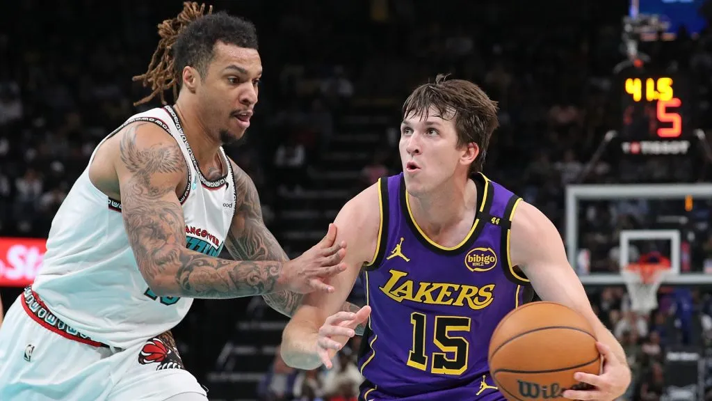 Austin Reaves #15 of the Los Angeles Lakers handles the ball against Brandon Clarke #15 of the Memphis Grizzlies during the first half at FedExForum. Justin Ford/Getty Images