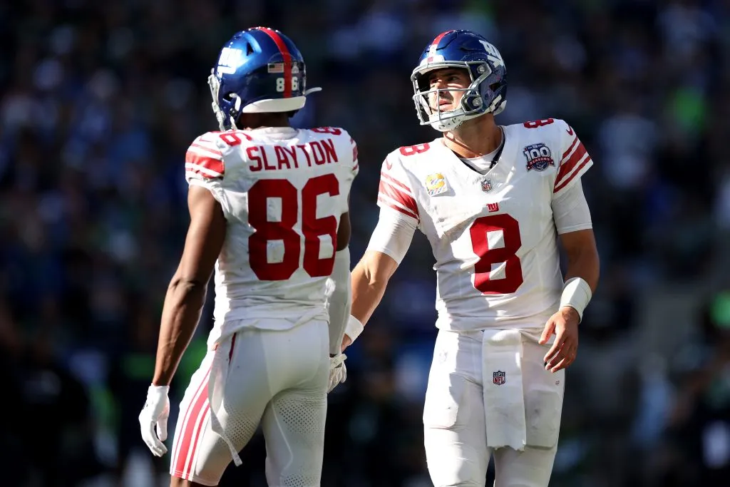 SEATTLE, WASHINGTON – OCTOBER 06: Darius Slayton #86 and Daniel Jones #8 of the New York Giants high five during the game against the Seattle Seahawks at Lumen Field on October 06, 2024 in Seattle, Washington. (Photo by Steph Chambers/Getty Images)