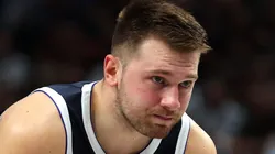 Luka Doncic #77 of the Dallas Mavericks holds his elbow after a fall on the court in the first half against the Houston Rockets at American Airlines Center on October 31, 2024 in Dallas, Texas.