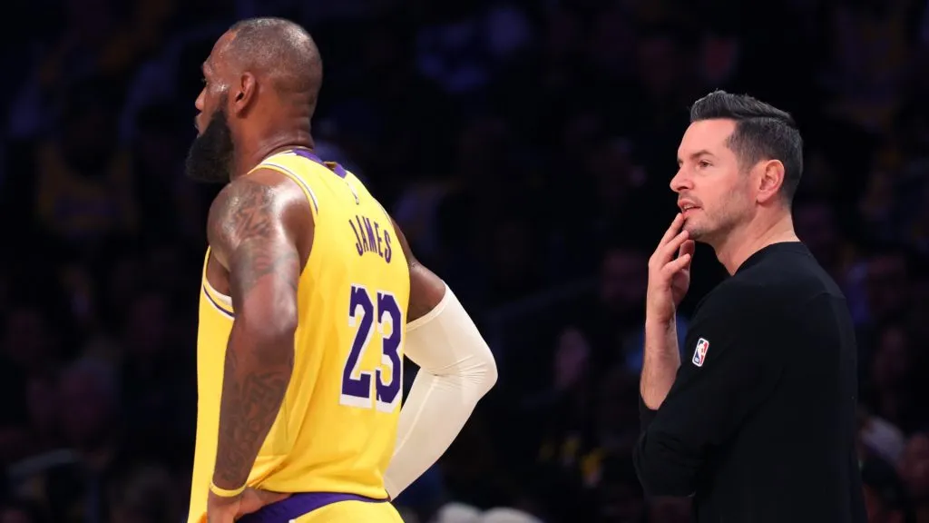 LeBron James #23 of the Los Angeles Lakers and head coach JJ Redick look on during the third quarter against the Minnesota Timberwolves at Crypto.com Arena on October 22, 2024 in Los Angeles, California. (Photo by Harry How/Getty Images)
