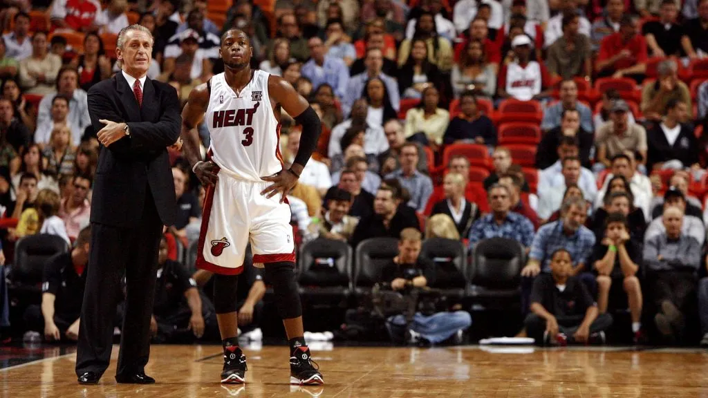 Head coach Pat Riley and Dwyane Wade #3 of the Miami Heat talk during free throws while taking on the Atlanta Hawks at American Airlines Arena on November 21, 2007 in Miami, Florida. 
