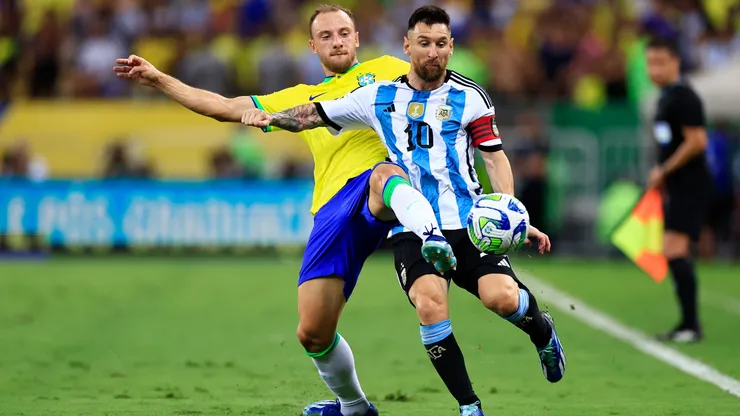 Lionel Messi of Argentina and Carlos Augusto of Brazil battle for the ball during a FIFA World Cup 2026 Qualifier match between Brazil and Argentina at Maracana Stadium on November 21, 2023 in Rio de Janeiro, Brazil.