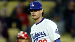 Relief pitcher Joe Kelly #99 of the Los Angeles Dodgers reacts to third base umpire after a balk call to score Matt Carpenter #13 of the St. Louis Cardinals from third base with the bases loaded during the seventh inning at Dodger Stadium on March 30, 2024 in Los Angeles, California.
