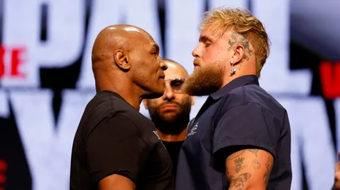 (L-R) Mike Tyson and Jake Paul speak onstage at the press conference in promotion for the upcoming Jake Paul vs. Mike Tyson boxing match at The Apollo Theater on May 13, 2024 in New York City.