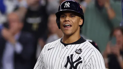 Juan Soto #22 of the New York Yankees waits to congratulate Aaron Judge #99 after Judge hit a two-run home run during the first inning of Game Five of the 2024 World Series against the Los Angeles Dodgers at Yankee Stadium on October 30, 2024 in the Bronx borough of New York City.