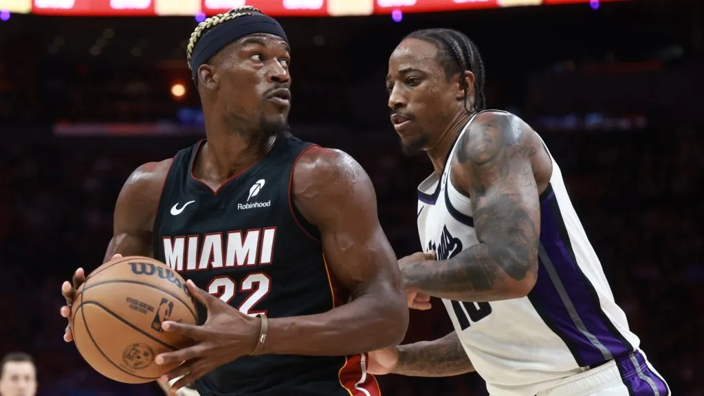 Jimmy Butler #22 of the Miami Heat controls the ball against DeMar DeRozan #10 of the Sacramento Kings during the second half at Kaseya Center. Carmen Mandato/Getty Images