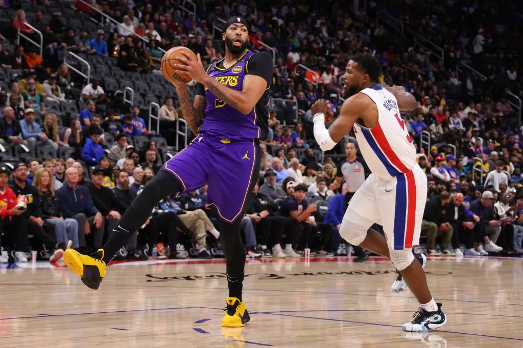 Anthony Davis #3 of the Los Angeles Lakers grabs a rebound in front of Malik Beasley #5 of the Detroit Pistons during the first quarter at Little Caesars Arena. Gregory Shamus/Getty Images