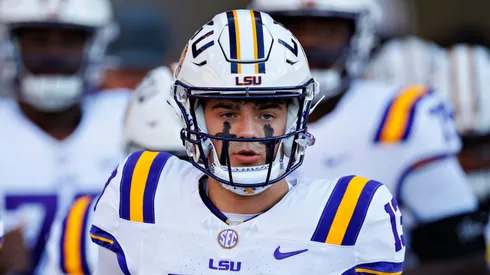 Garrett Nussmeier #13 of the LSU Tigers leads the team onto the field before the game against the Arkansas Razorbacks at Donald W. Reynolds Razorback Stadium on October 19, 2024 in Fayetteville, Arkansas.
