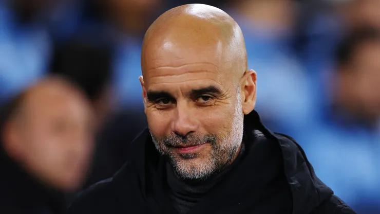 Pep Guardiola, Manager of Manchester City, looks on prior to the UEFA Champions League match between Manchester City and Rb Leipzig at Etihad Stadium on November 28, 2023.