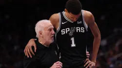 Head coach Gregg Popovich of the San Antonio Spurs talks to Victor Wembanyama #1 during the second half while playing the Detroit Pistons at Little Caesars Arena on January 10, 2024 in Detroit, Michigan.