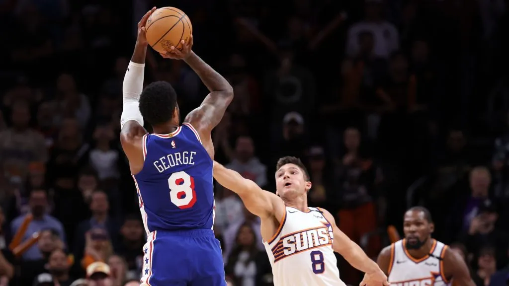 Paul George #8 of the Philadelphia 76ers attempts a three-point shot over Grayson Allen #8 of the Phoenix Suns during the second half at Footprint Center on November 04, 2024 in Phoenix, Arizona. (Photo by Chris Coduto/Getty Images)