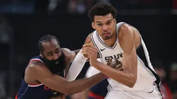 Victor Wembanyama #1 of the San Antonio Spurs and James Harden #1 of the LA Clippers chase after a ball during the first half at Intuit Dome on November 04, 2024 in Inglewood, California.