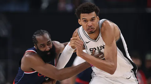 Victor Wembanyama #1 of the San Antonio Spurs and James Harden #1 of the LA Clippers chase after a ball during the first half at Intuit Dome on November 04, 2024 in Inglewood, California.