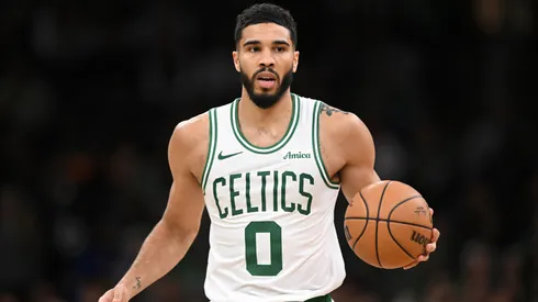 Jayson Tatum #0 of the Boston Celtics dribbles the ball up the court during the second half of a game against the Milwaukee Bucks