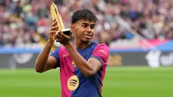Lamine Yamal of FC Barcelona acknowledges the fans as he displays his 2024 Kopa Trophy prior to the La Liga EA Sports match between FC Barcelona and RCD Espanyol at Estadi Olimpic Lluis Companys on November 03, 2024 in Barcelona, Spain.