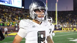 Dillon Gabriel #8 of the Oregon Ducks reacts after a touchdown during the fourth quarter against the Michigan Wolverines at Michigan Stadium on November 02, 2024 in Ann Arbor, Michigan