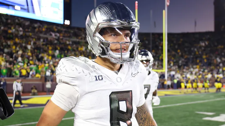 Dillon Gabriel #8 of the Oregon Ducks reacts after a touchdown during the fourth quarter against the Michigan Wolverines at Michigan Stadium on November 02, 2024 in Ann Arbor, Michigan