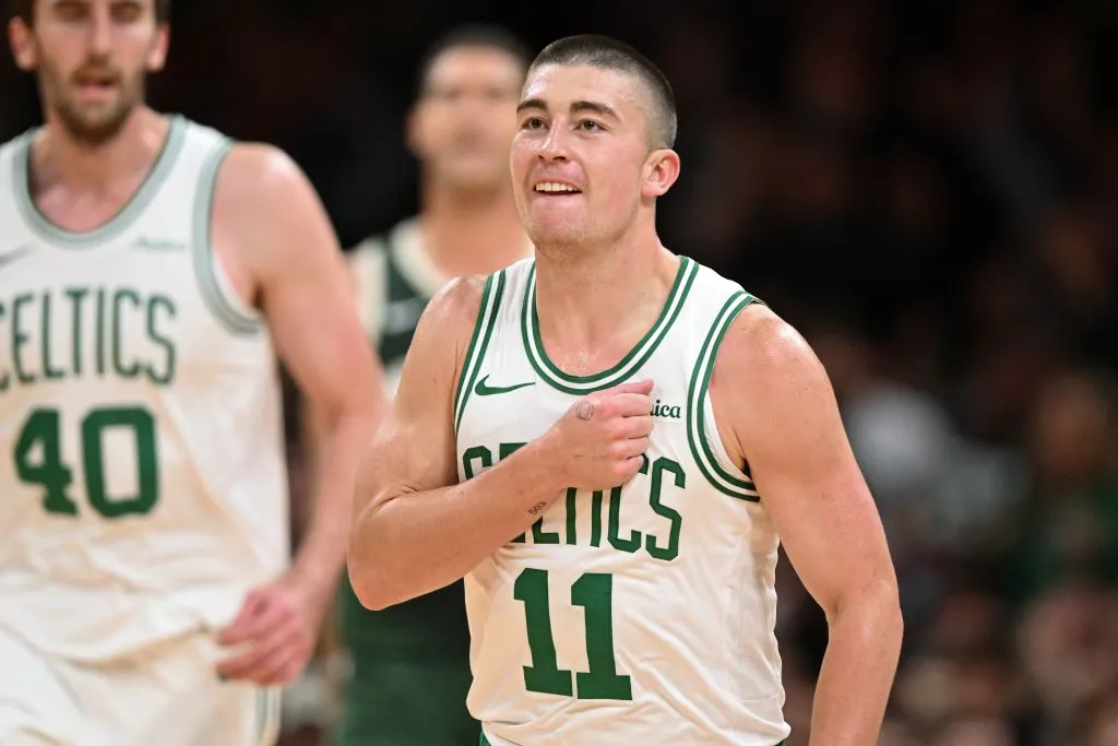 Payton Pritchard #11 of the Boston Celtics reacts after making a three-point basket against the Milwaukee Bucks during the first half at the TD Garden on October 28, 2024 in Boston, Massachusetts. 