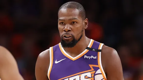 Kevin Durant #35 of the Phoenix Suns reacts with Ryan Dunn #0 after scoring against the Dallas Mavericks during the NBA game at Footprint Center on October 26, 2024 in Phoenix, Arizona. The Suns defeated the Mavericks 114-102.