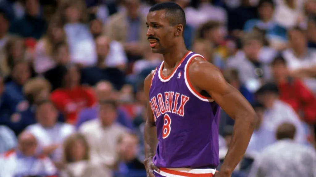 Eddie Johnson #8 of the Phoenix Suns looks on during a 1989 season NBA game at Veteran's Memorial Coliseum in Phoenix, Arizona.