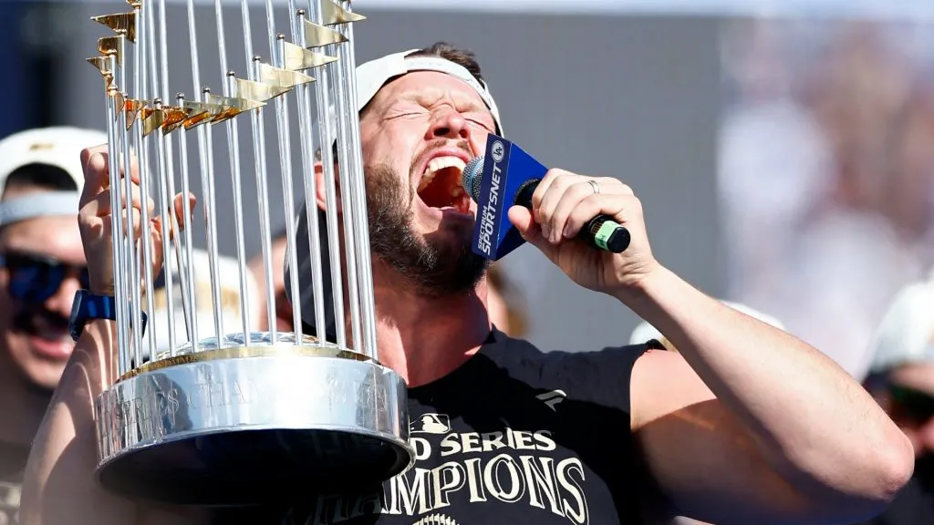 Clayton Kershaw #22 of the Los Angeles Dodgers celebrates with the Commissioners’ Trophy during the 2024 World Series Celebration Show at Dodger Stadium on November 01, 2024 in Los Angeles, California. (Photo by Ronald Martinez/Getty Images)