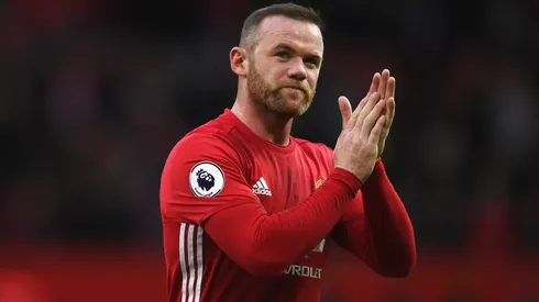 Wayne Rooney of Manchester United shows appreciation to the fans after the final whistle during the Premier League match between Manchester United and Arsenal
