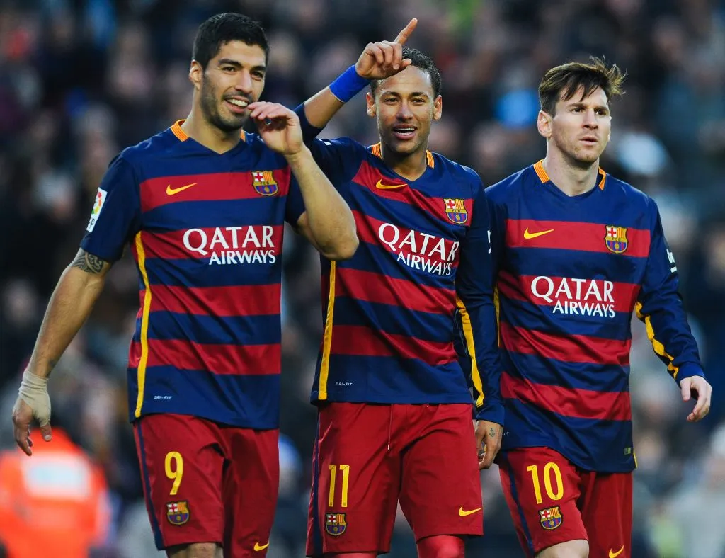 Neymar of FC Barcelona celebrates with his teammates Luis Suarez and Lionel Messi of FC Barcelona after scoring his team’s third goal. David Ramos/Getty Images
