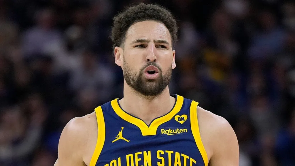 Klay Thompson #11 of the Golden State Warriors reacts after making a three-point shot against the Utah Jazz during first half at Chase Center on April 07, 2024 in San Francisco, California.