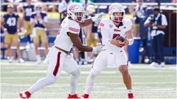 Miami (OH) quarterback Brett Gabbert hands the ball