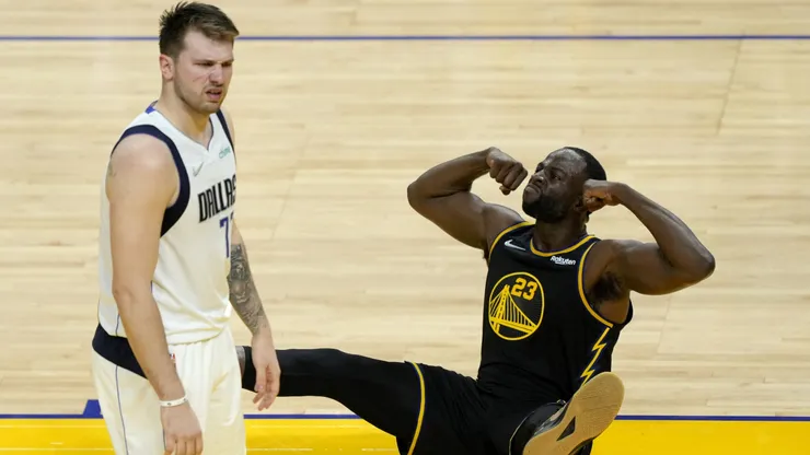 Draymond Green #23 of the Golden State Warriors reacts against Luka Doncic #77 of the Dallas Mavericks during the second quarter in Game One of the 2022 NBA Playoffs Western Conference Finals at Chase Center on May 18, 2022 in San Francisco, California.