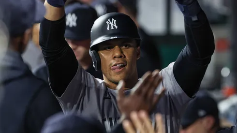 New York Yankees right fielder Juan Soto (22) celebrates scoring a run with teammates against the Kansas City Royals during the fourth inning of game 3 of the American League Division Series at Kauffman Stadium in Kansas City, MO.