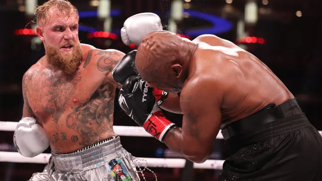 Jake Paul punches Mike Tyson during LIVE On Netflix: Jake Paul vs. Mike Tyson at AT&amp;T Stadium on November 15, 2024 in Arlington, Texas. (Photo by Al Bello/Getty Images for Netflix © 2024)