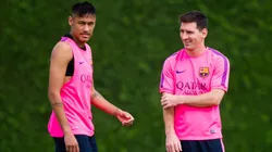 Neymar (L) and Lionel Messi (R) look on during a FC Barcelona training session at Ciutat Esportiva on August 17, 2014 in Barcelona, Spain.