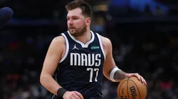 Luka Doncic #77 of the Dallas Mavericks dribbles the ball against the Washington Wizards at Capital One Arena