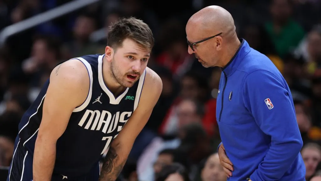 Head coach Jason Kidd (R) talks with his player Luka Doncic #77 of the Dallas Mavericks against the Washington Wizards during the first half at Capital One Arena. (Patrick Smith/Getty Images)