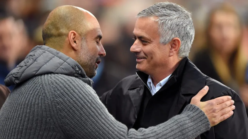 Josep Guardiola, Manager of Manchester City and Jose Mourinho, Manager of Manchester United embrace prior to the Premier League match between Manchester City and Manchester United at Etihad Stadium. (Mike Hewitt/Getty Images)