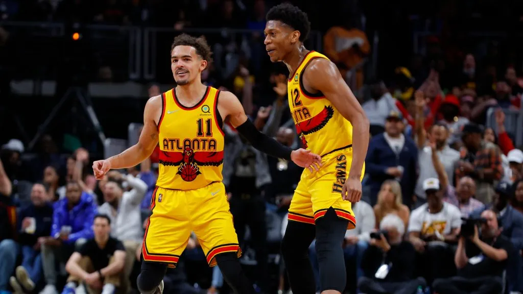 Trae Young #11 reacts with De’Andre Hunter #12 of the Atlanta Hawks during the second half against the Brooklyn Nets at State Farm Arena. (Todd Kirkland/Getty Images)