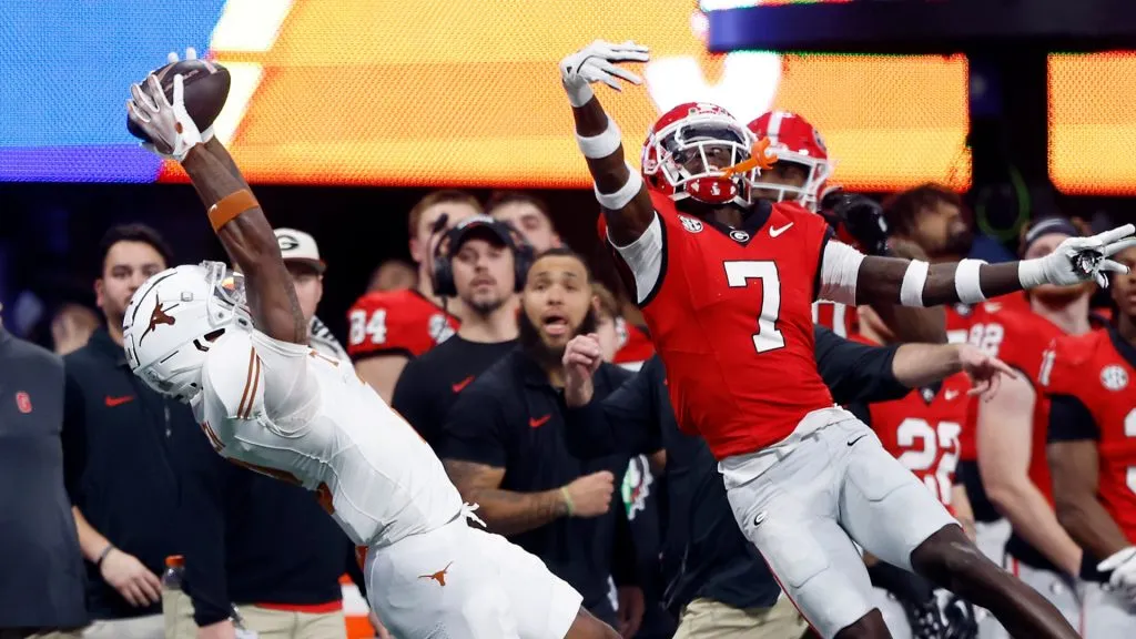 Matthew Golden #2 of the Texas Longhorns makes a catch against Daniel Harris #7 of the Georgia Bulldogs during the first quarter of the 2024 SEC Championship at Mercedes-Benz Stadium on December 07, 2024 in Atlanta, Georgia.
