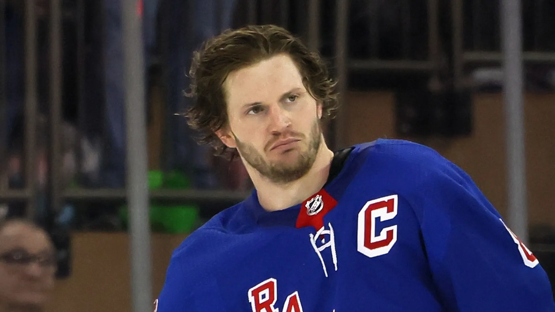 Jacob Trouba #8 of the New York Rangers is escorted off the ice following his second period fight with Dillon Dube #29 of the Calgary Flames at Madison Square Garden on February 06, 2023 in New York City.