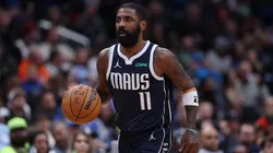 Kyrie Irving #11 of the Dallas Mavericks dribbles the ball against the Washington Wizards during the second half at Capital One Arena.
