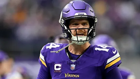 Sam Darnold #14 of the Minnesota Vikings celebrates after throwing a touchdown pass against the Atlanta Falcons during the second quarter at U.S. Bank Stadium on December 08, 2024 in Minneapolis, Minnesota.