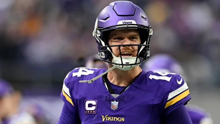 Sam Darnold #14 of the Minnesota Vikings celebrates after throwing a touchdown pass against the Atlanta Falcons during the second quarter at U.S. Bank Stadium on December 08, 2024 in Minneapolis, Minnesota.