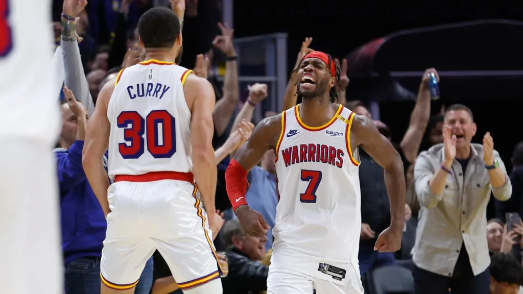 Buddy Hield #7 of the Golden State Warriors celebrates with Stephen Curry #30 after making a three-point basket in the fourth quarter against the Minnesota Timberwolves at Chase Center. ((Lachlan Cunningham/Getty Images)