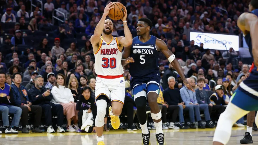 Stephen Curry #30 of the Golden State Warriors is fouled by Anthony Edwards #5 of the Minnesota Timberwolves in the second quarter at Chase Center. (Lachlan Cunningham/Getty Images)