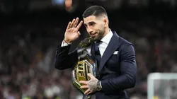 Ilia Topuria , UFC Featherweight Champion, is seen with his belt on the pitch prior to the LaLiga EA Sports match between Real Madrid CF and Sevilla FC
