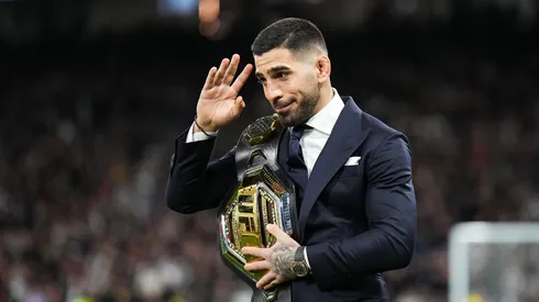 Ilia Topuria , UFC Featherweight Champion, is seen with his belt on the pitch prior to the LaLiga EA Sports match between Real Madrid CF and Sevilla FC